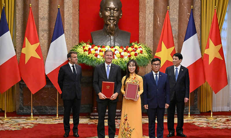 France, Vietnam sign deals worth  $10 billion as Macron visits Hanoi
